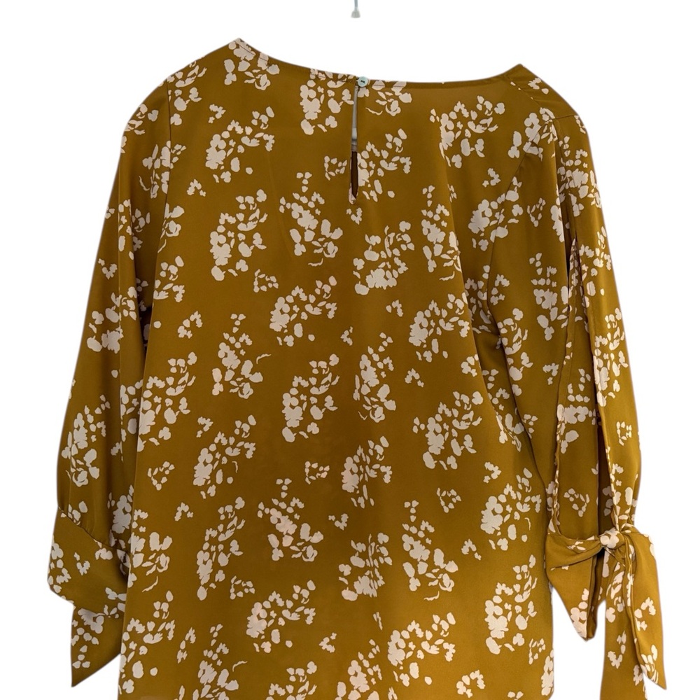 West Kei, Floral Mustard Women's Top, with tie sleeves.